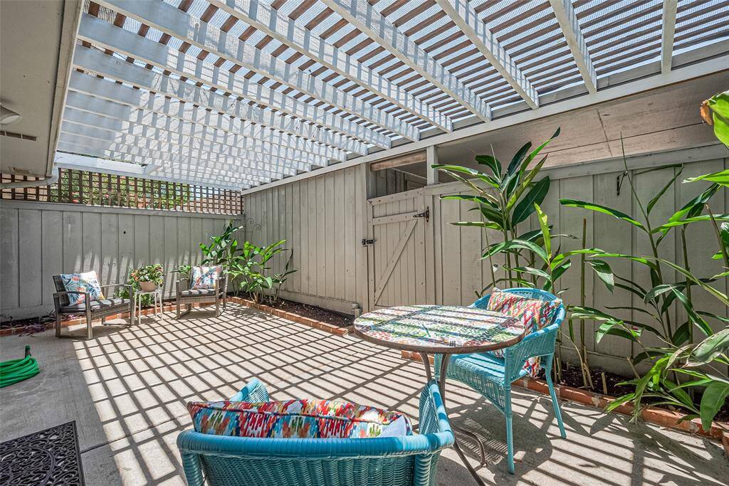 The seamless connection to the dining area through sliding glass doors makes it easy to extend your living space outdoors. Whether you’re hosting friends or enjoying a quiet moment, this patio is a true gem.