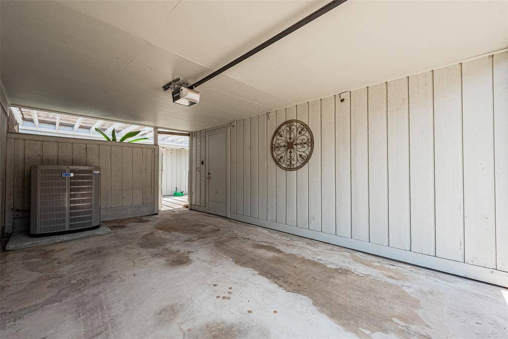 Very spacious two car garage.  One side is a gated carport and the other side is a great storage area!