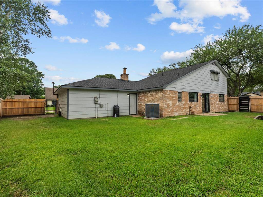 Expansive and serene backyard, perfect for relaxation and outdoor activities.