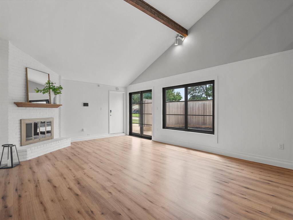Expansive living room with easy access to the garage and side courtyard.