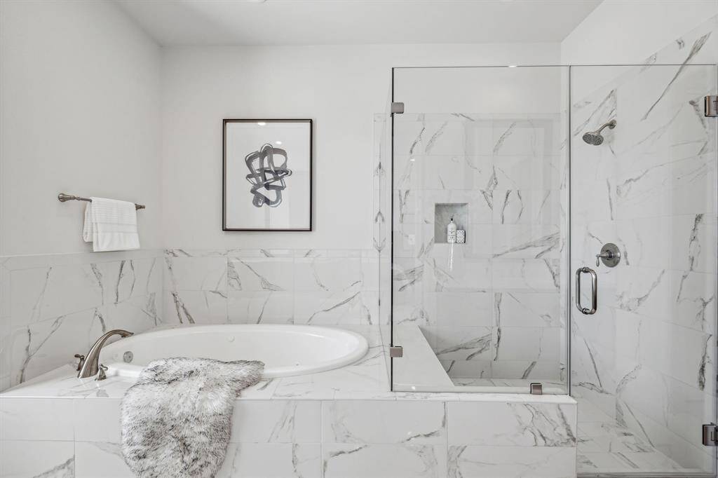 Tub shower combination in the primary bathroom