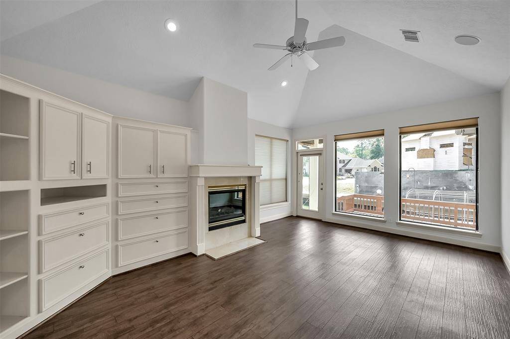 Primary Bedroom #1 with a fireplace and built in storage/shelving