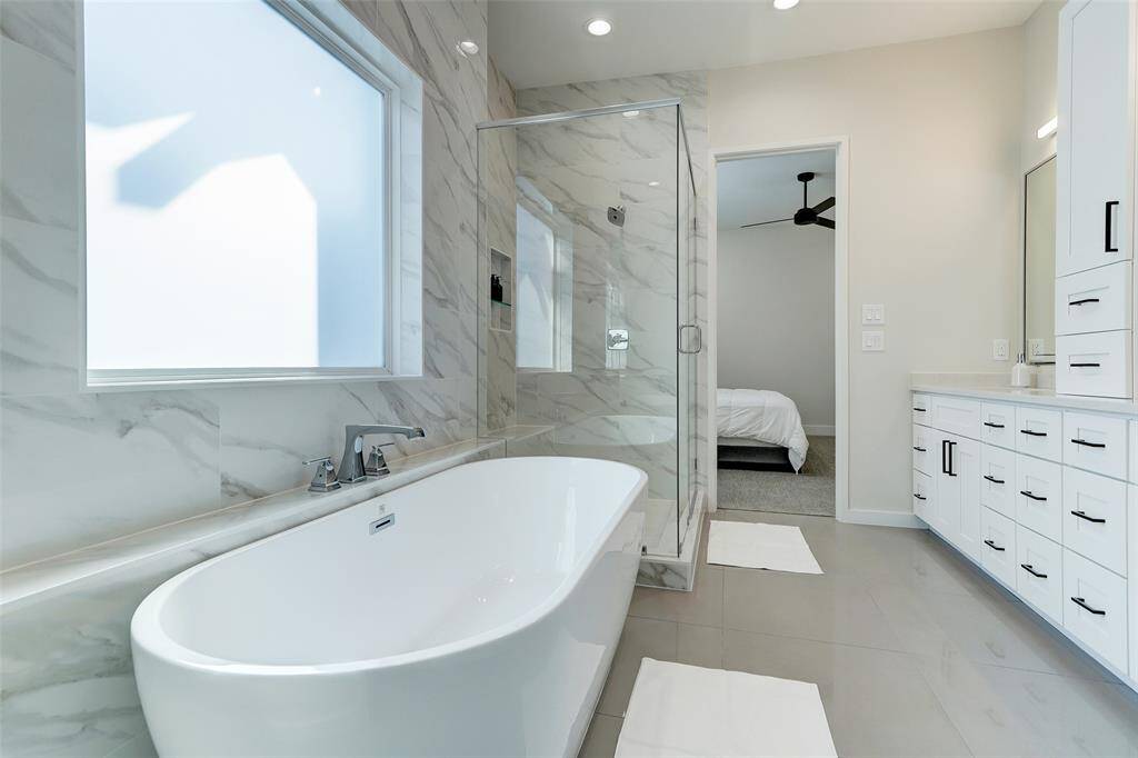 The spa like retreat is just what the doctor ordered! Look at all that storage and soaking tub!