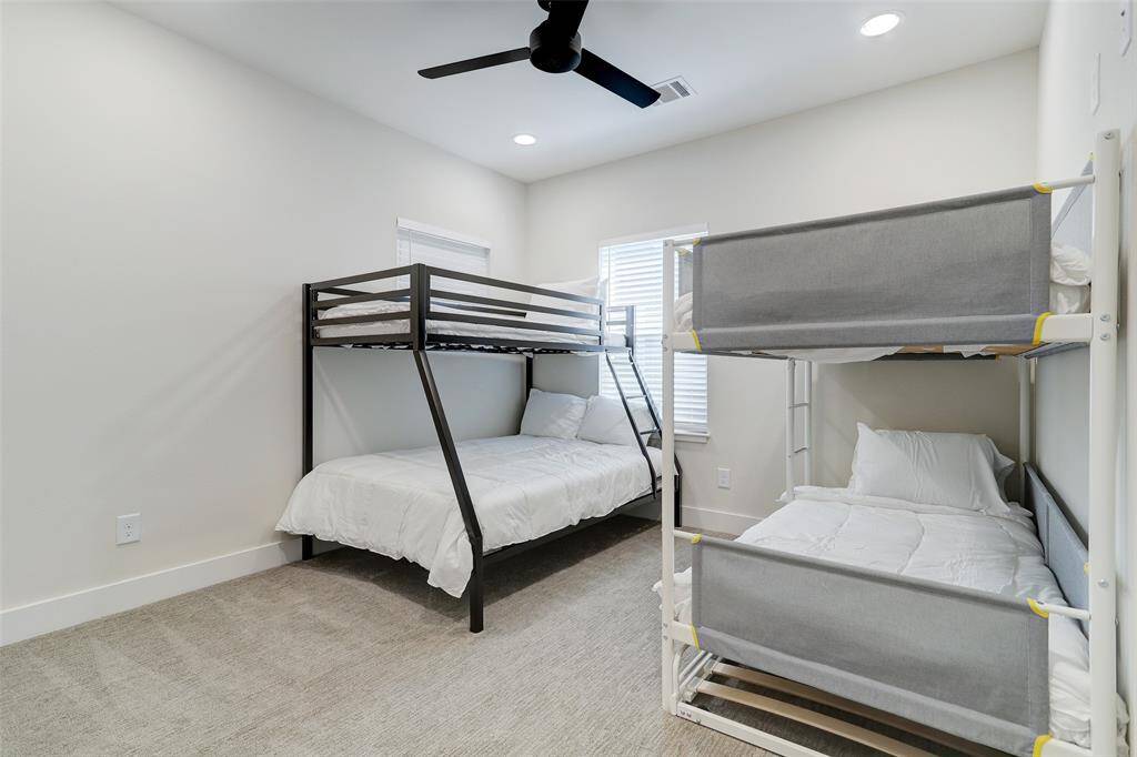 Secondary bedroom with an en suite bathroom located on the third floor.