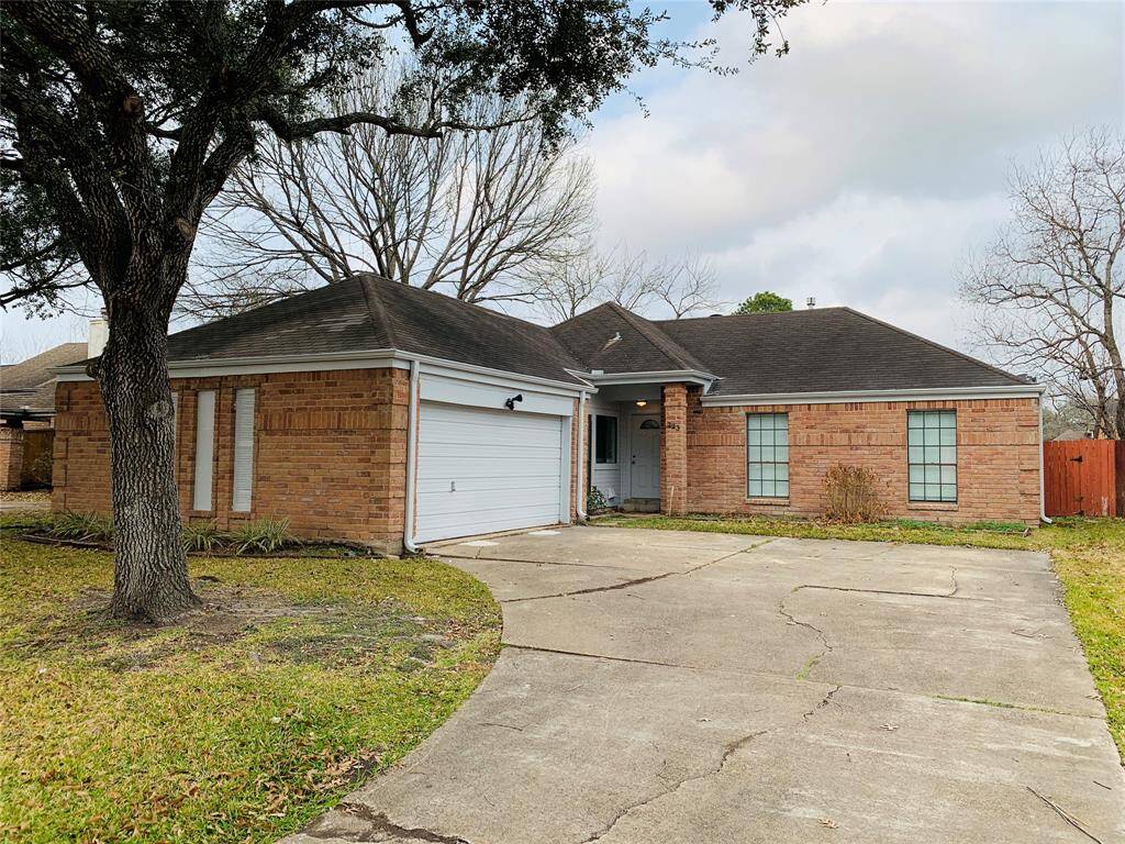 Recent exterior painting and extended driveway for parking.