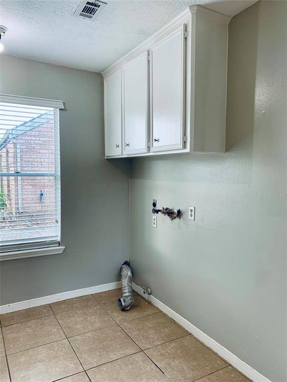 Laundry room is plenty spacious with good natural light!