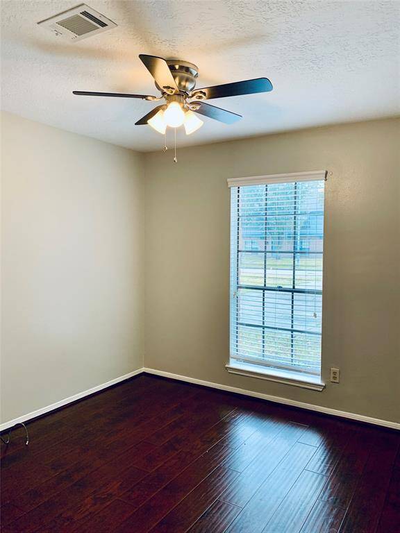 Third bedroom has walk in closet and ceiling fan.