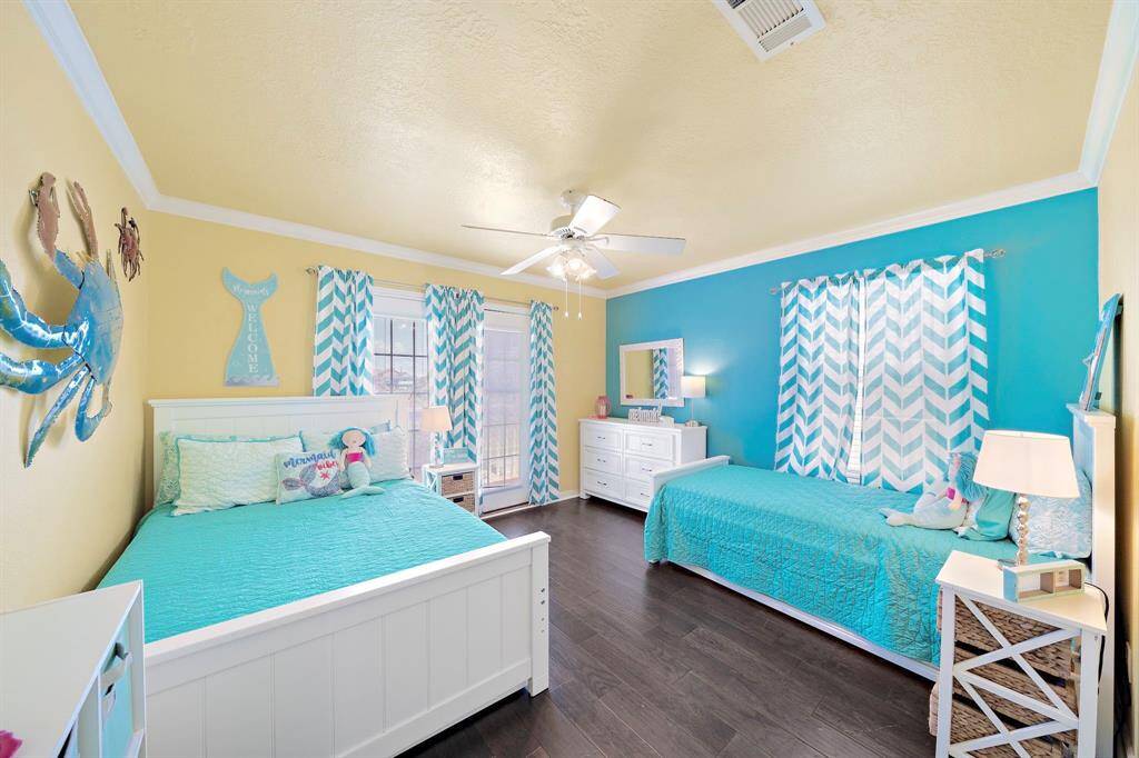 Simply adorable mermaid-themed bedroom with French doors accessible to deck.