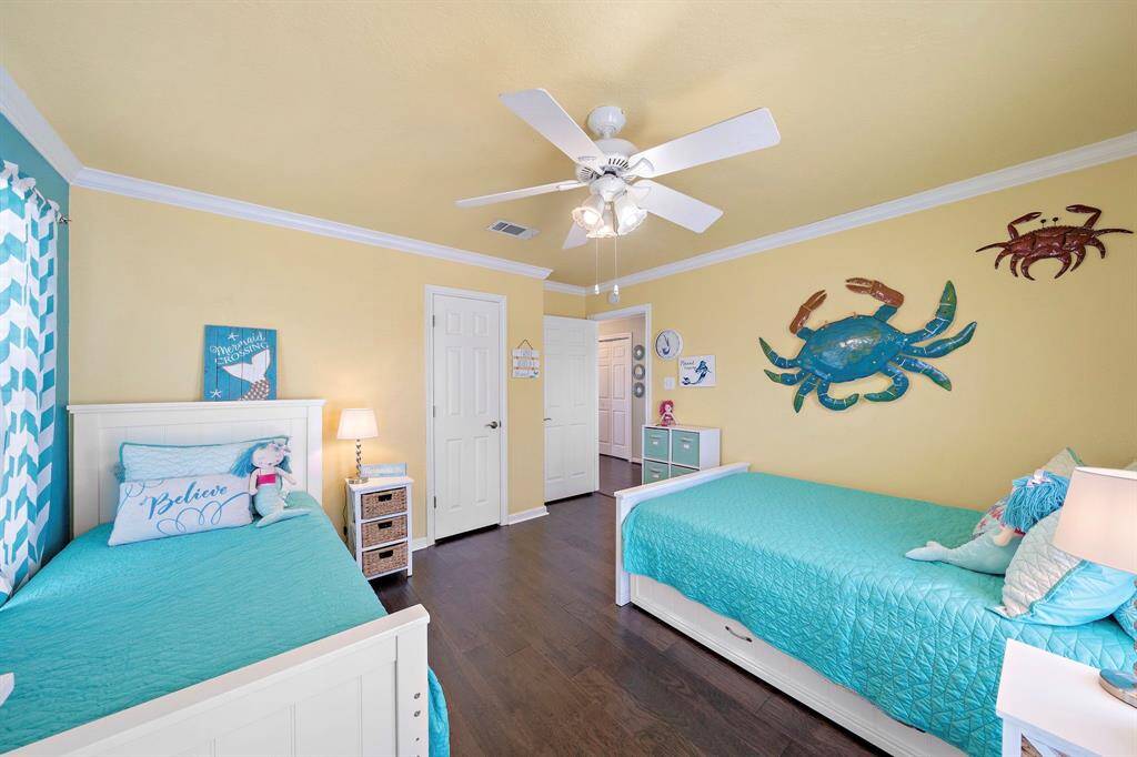 Trundle beds indicate this large mermaid themed room will host some great times!