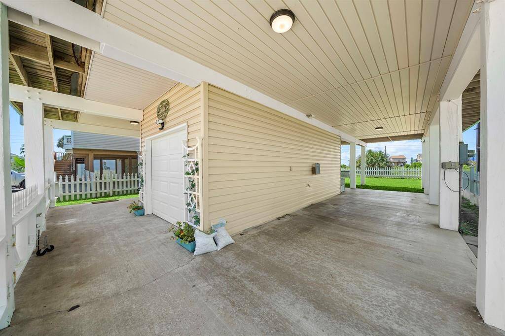 Gated carport allows furry friends or tiny tots a secure place to take a break from fun in the sun.