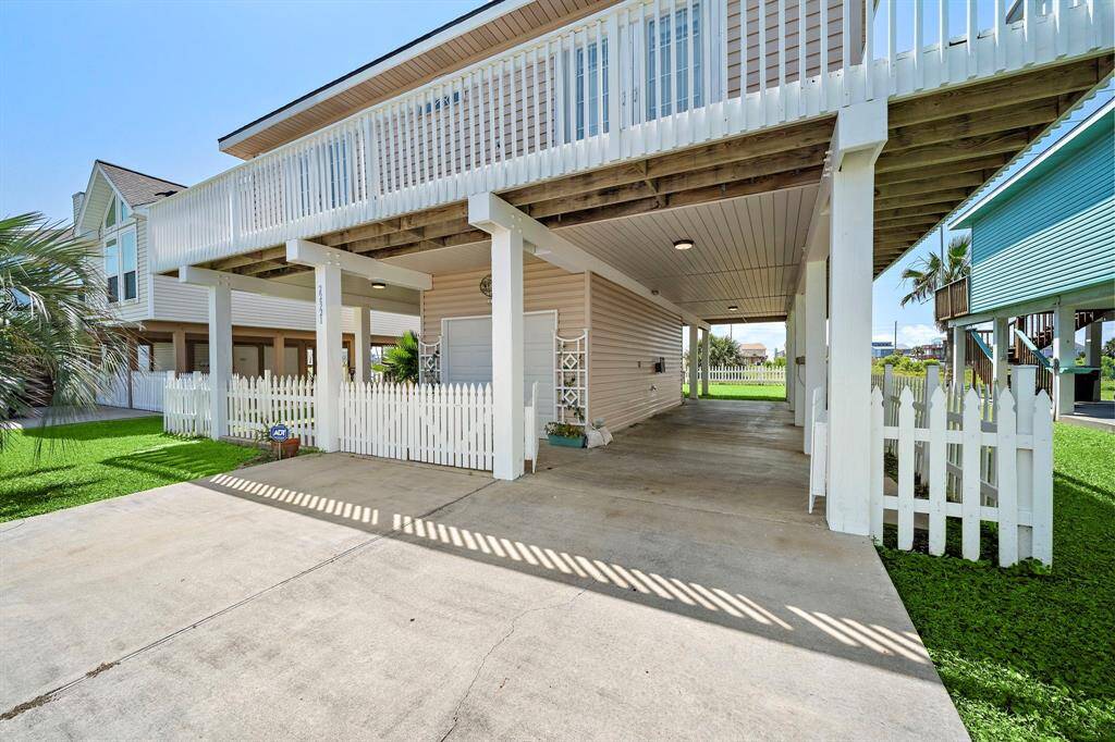 2-car driveway with multiple storage and entertaining options with oversized garage & carport.