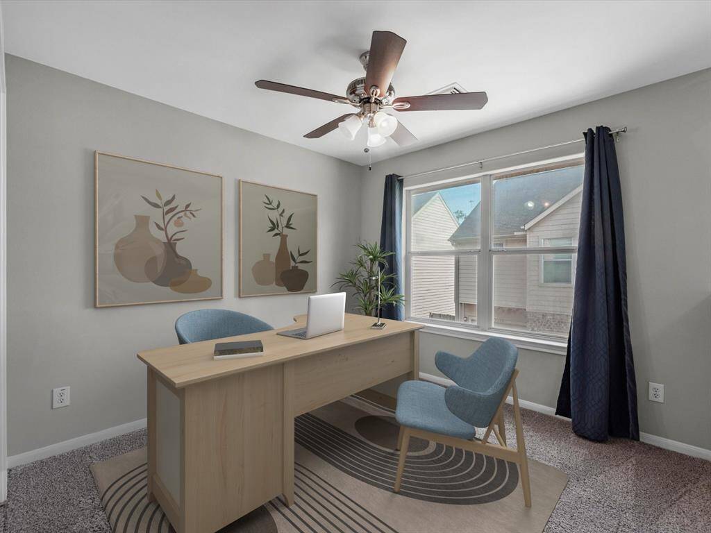 Upstairs features two bedrooms and this versatile gameroom that can serve as a home office.(Photo has been virtually staged.)