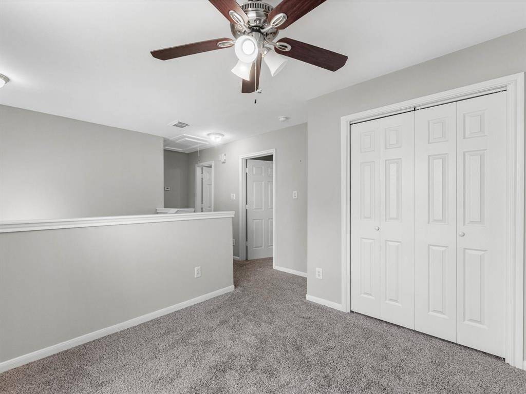 An alternate view of the gameroom/home office. Notice the double door closet to the right!