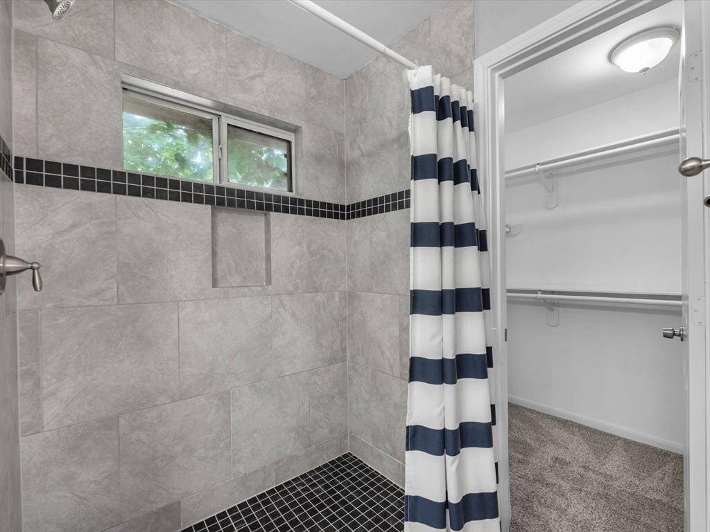 Through the primary bathroom is a large walk in closet.