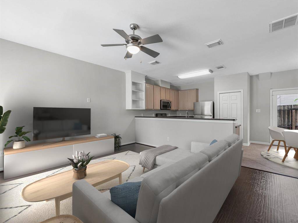 Upon entering, one notices the spacious feeling from the open concept design.(Photo has been virtually staged.)