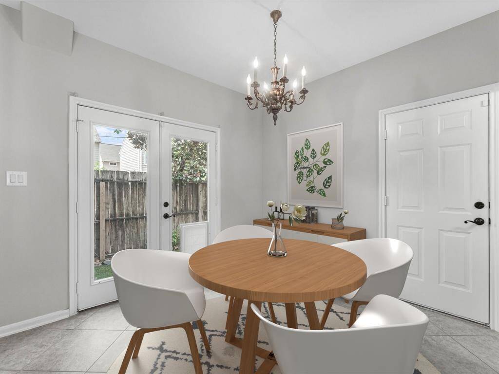 The cozy dining area has a view of the backyard.(Photo has been virtually staged.)