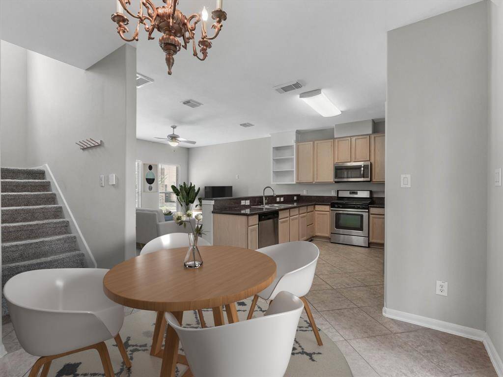An alternate view of the dining area, showcasing the open concept floorplan. (Photo has been virtually staged.)