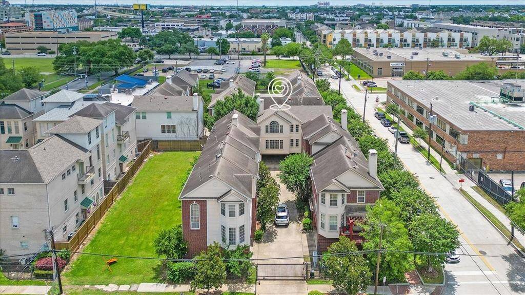 Wide-angle view of the community with the home clearly marked—showcasing the gated setting, quiet street, and easy access to surrounding businesses and Midtown amenities.