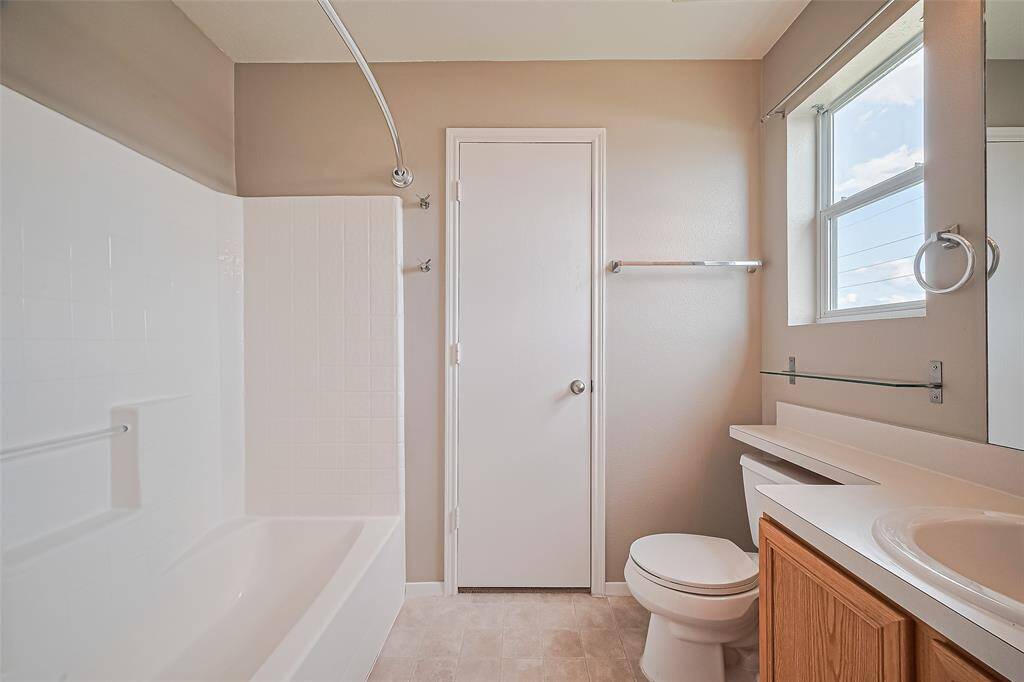 Primary bathroom with walk in closet.