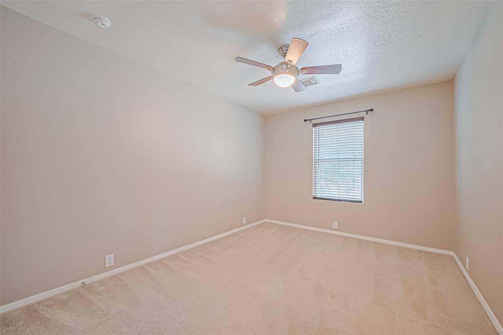 Secondary bedroom with closet space.