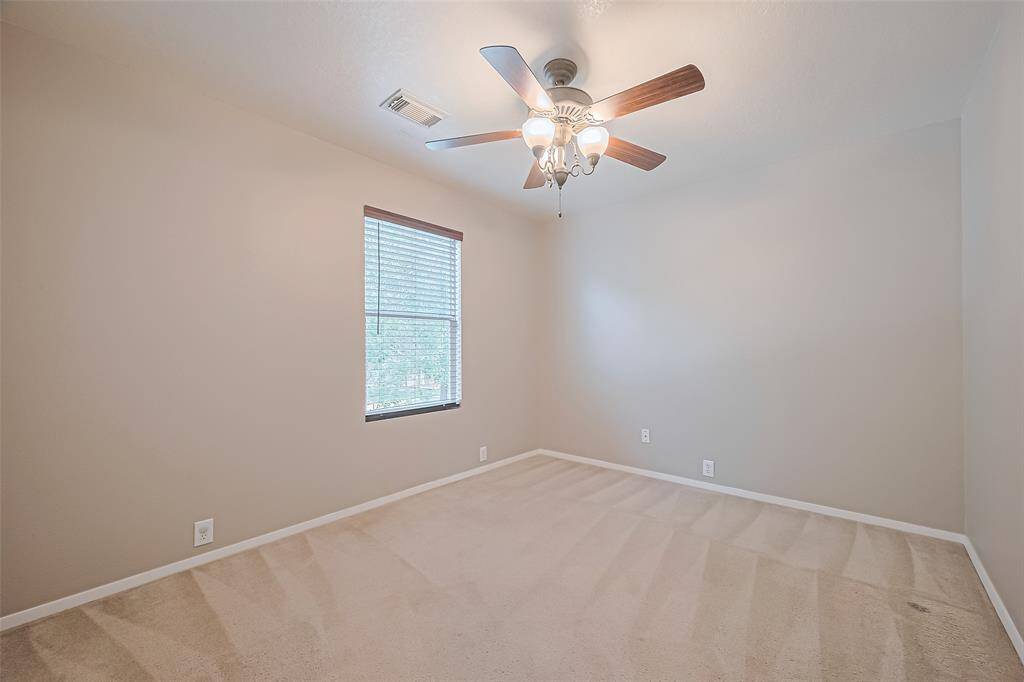 Secondary bedroom with closet space.