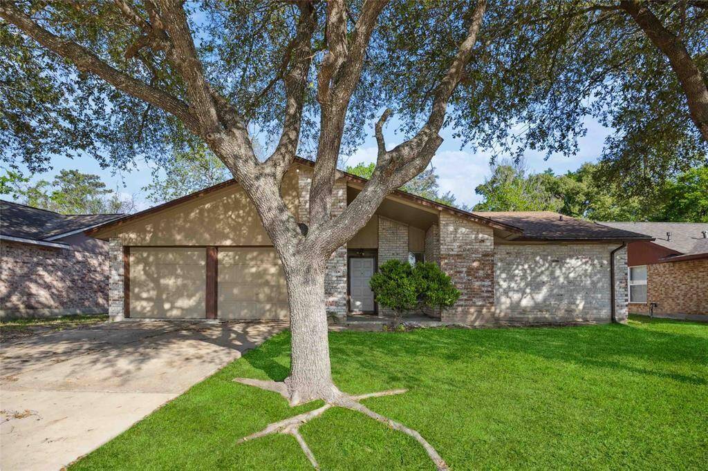 Welcoming front elevation with a beautifully shaded driveway.