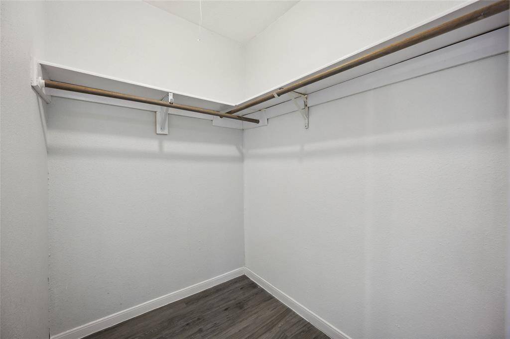 Expansive master bathroom closet with ample storage space.