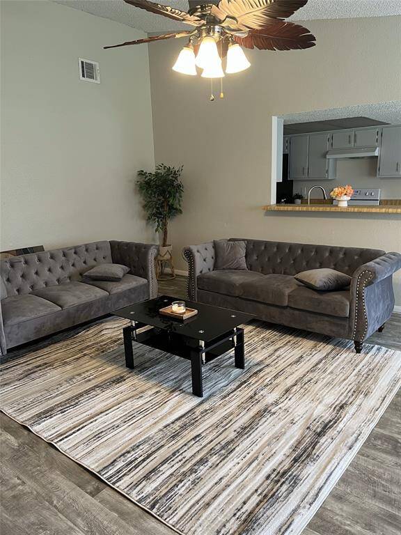 Discover a stunning living room with tall ceilings and an inviting open floor plan.