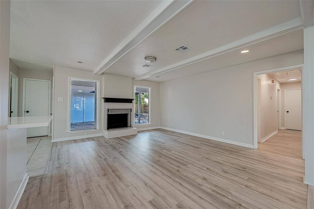 View of the additional living space with the gas fireplace.