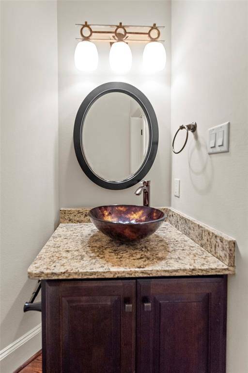 Second floor powder room tucked behind mini bar