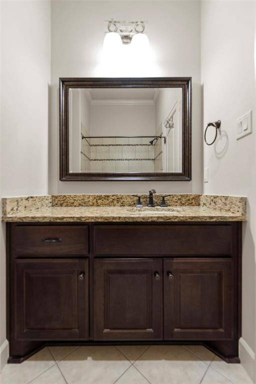 Secondary bedroom has ensuite full bath with tub and shower