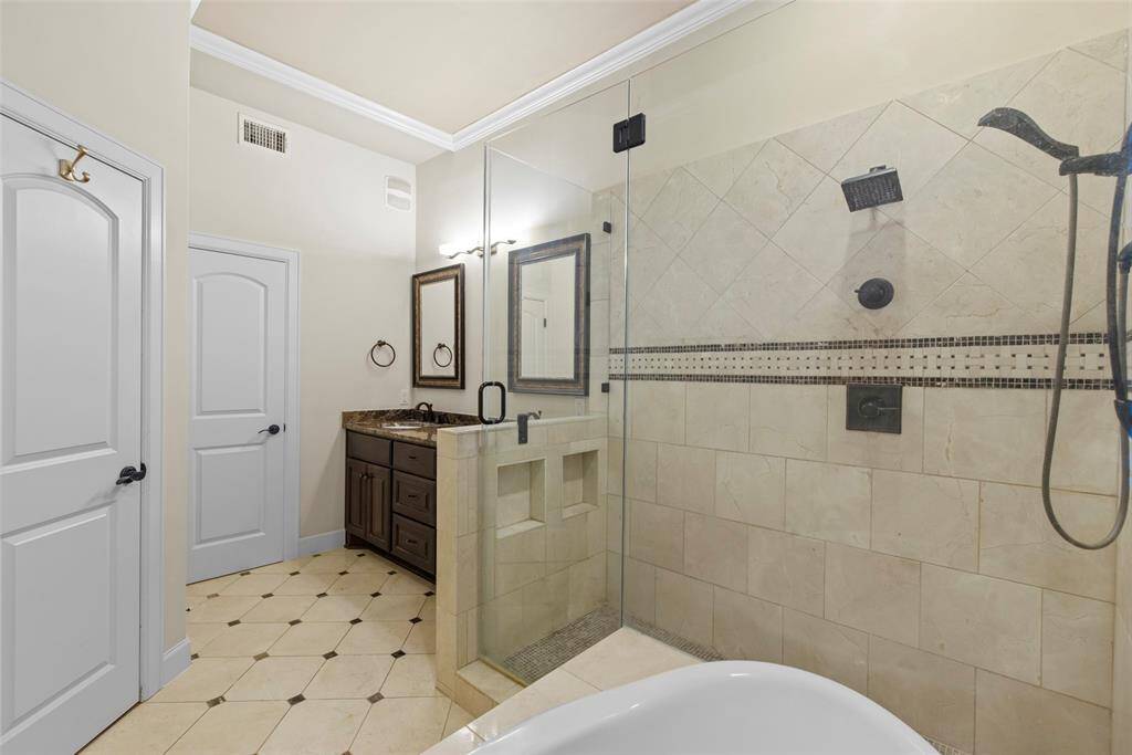Another view of primary bath with double vanity