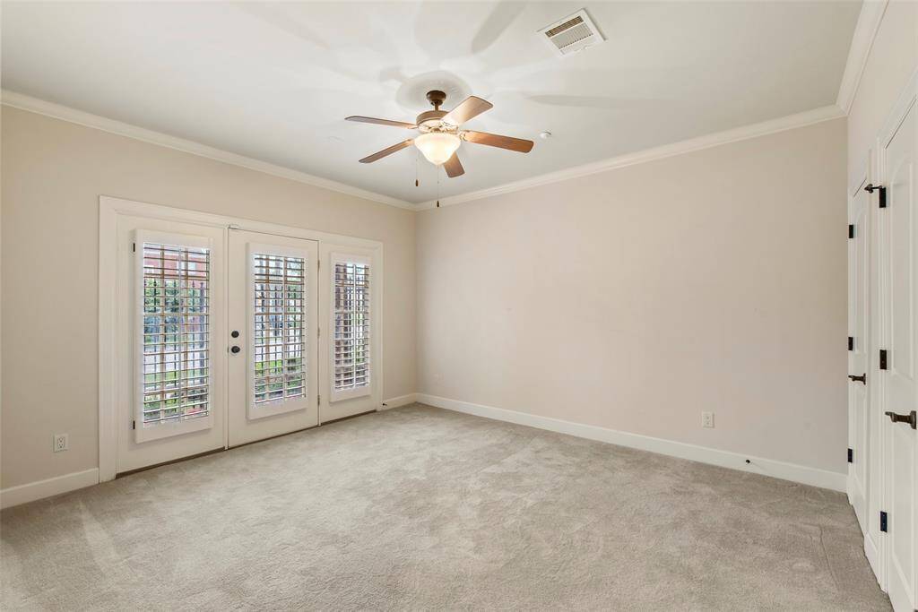 First floor office or bedroom with french doors to covered porch