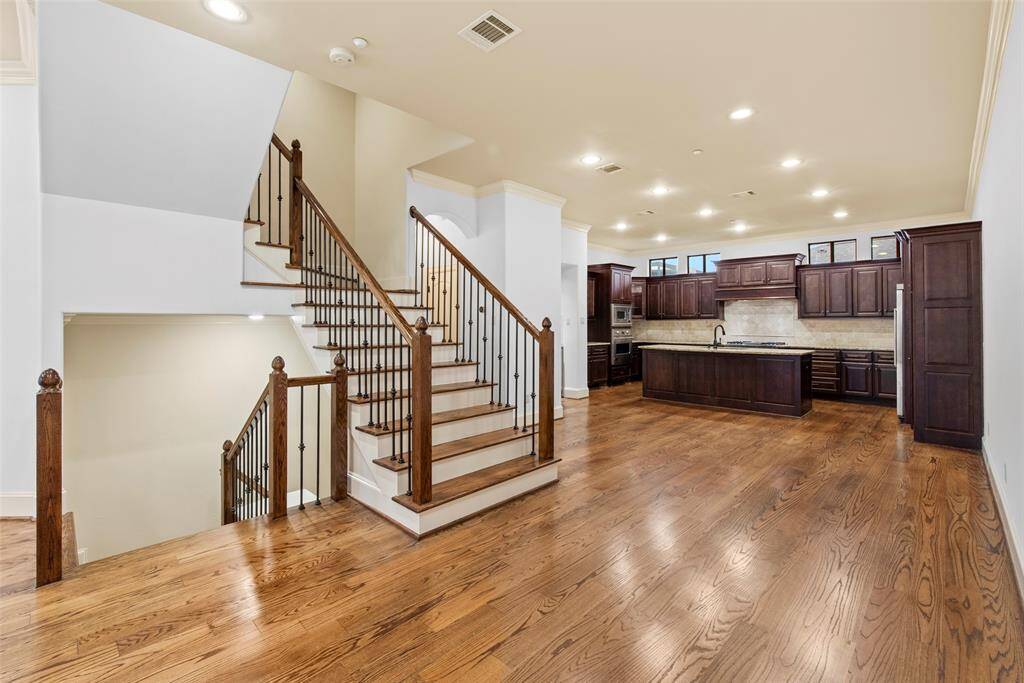 Second floor living space with chef's kitchen, gas log fireplace and balcony to enjoy a cup of coffee or glass of wine