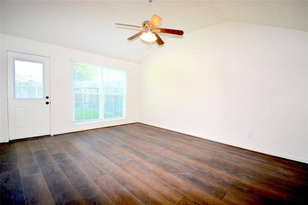 View of the primary suite with abundant natural light, high ceilings and private access to the back yard