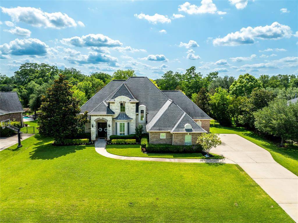 THIS ELEGANT ESTATE IS PERFECTLY SITUATED ON OVER HALF AN ACRES IN THE COMMUNITY OF WESTCREEK.