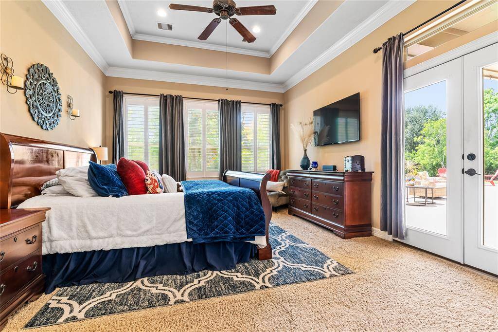 PRIMARY BEDROOM WITH DIRECT ACCESS TO THE BACKYARD—YOUR PRIVATE RETREAT JUST STEPS AWAY.