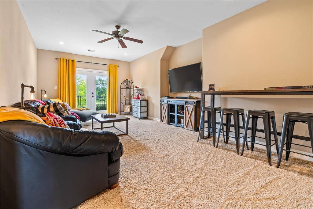 VERSATILE GAMEROOM—IDEAL FOR A MOTHER-IN-LAW SUITE, COLLEGE STUDENT SPACE, OR DUAL STUDY & ENTERTAINMENT ROOM.