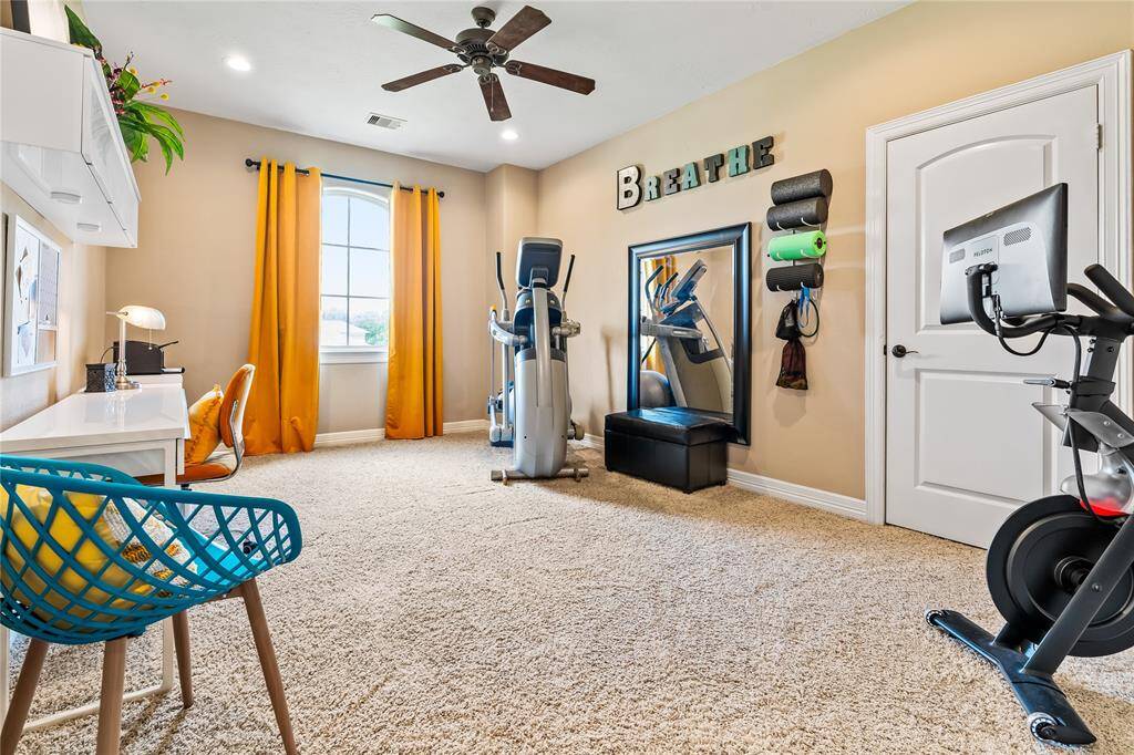 FLEX ROOM UPSTAIRS OFFERS SPACE FOR A HOME GYM, STUDY AREA, OR CRAFT ROOM WITH ROOM TO SPARE.