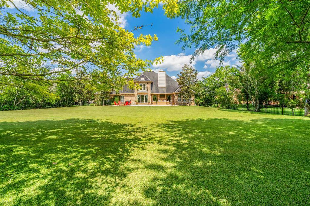 MASSIVE POOL-SIZED YARD WITH MATURE TREES FOR PRIVACY.