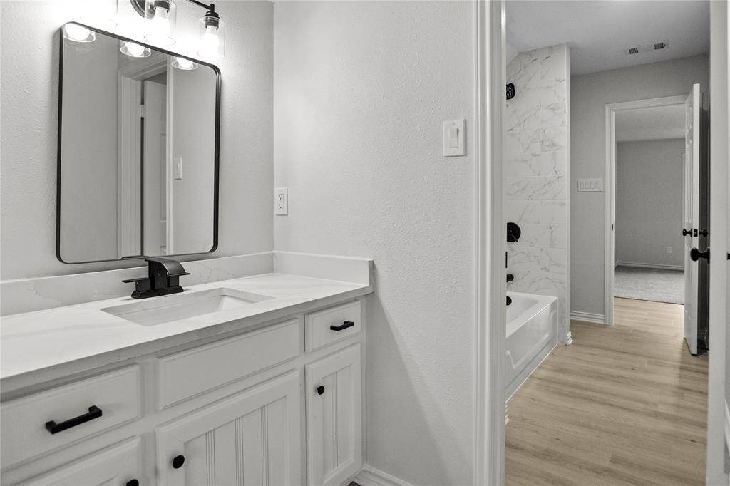 Upstairs Jack and Jill Bathroom- private vanity with each bedroom.