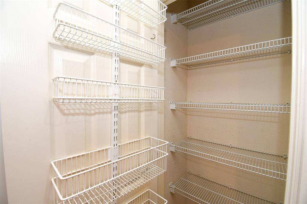 Pantry's interior has added storage shelving from top to bottom.