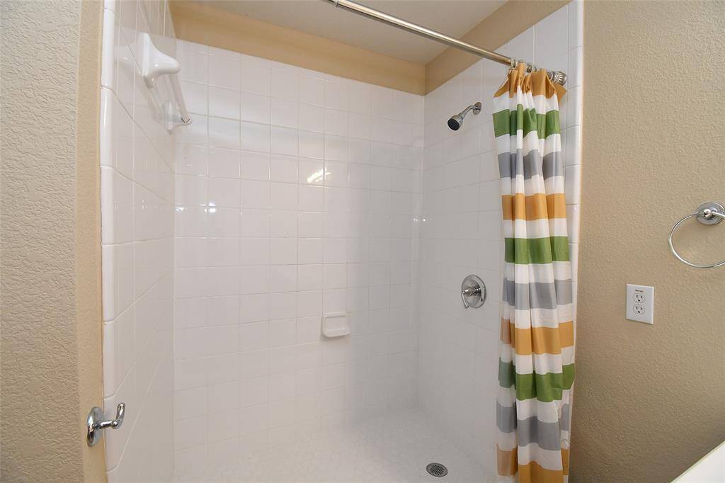 Newly installed walk-in shower is almost 4 ft deep by 5 ft wide.