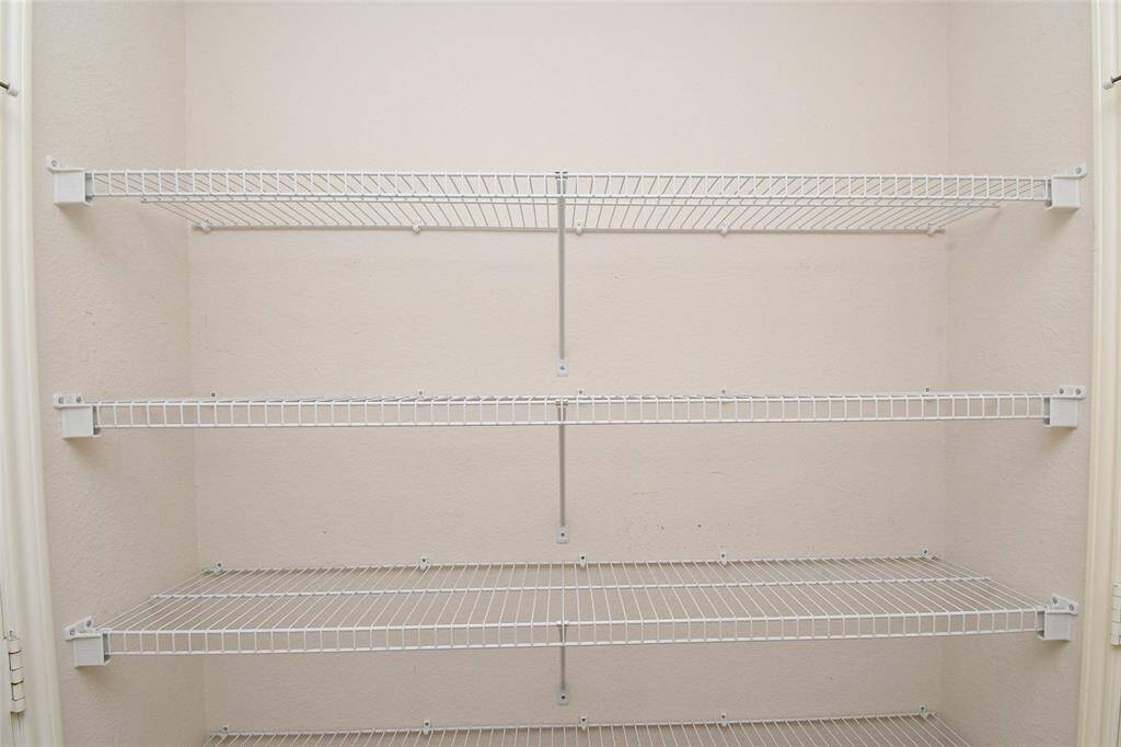 Utility Room storage area offers great storage space for backpacks and supplies.