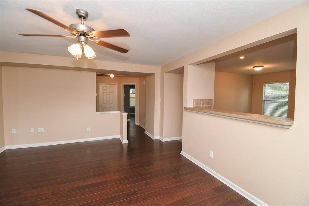 Large formal Dining area adjoins the Kitchen by way of the long breakfast bar. Hallway at rear leads to all Bedrooms, Utility Room and Garage.