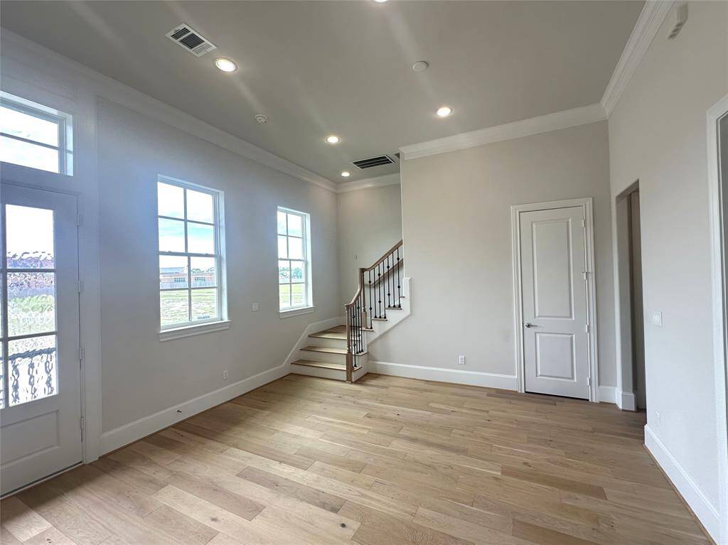 Great Natural Light! 12 FT Soaring Ceilings.  Double Crown Molding for the Extra Touch!