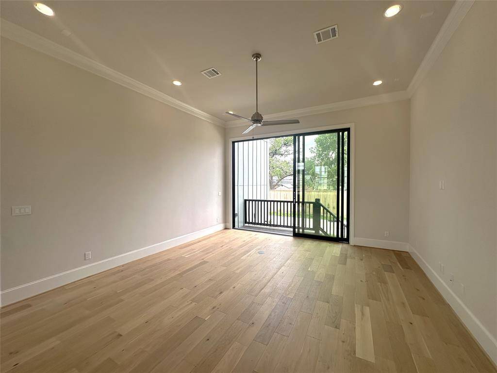 Living Room Has those Great 10 FT Tall, 12 FT Wide sliding glass doors that will open to a future fenced-in back yard.