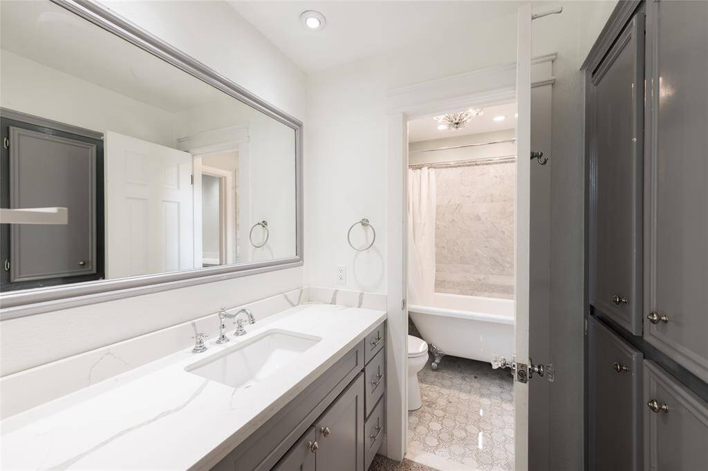 Another bathroom upstairs with a clawfoot tub