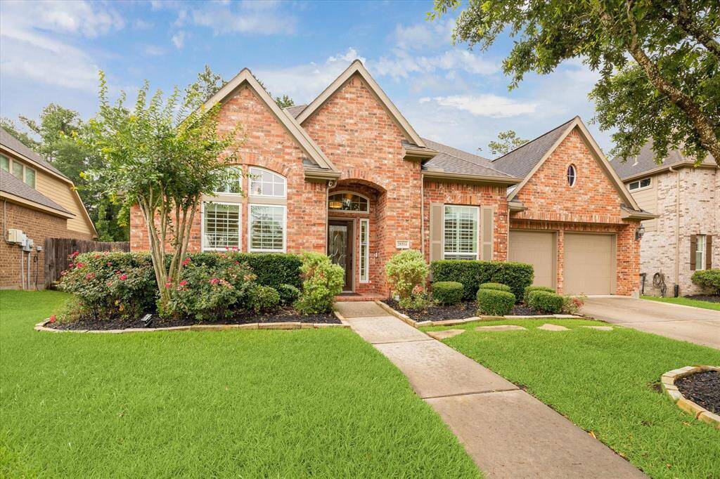 Welcome home to stunning curb appeal! This property features a well-manicured lawn, classic brick exterior, and expansive windows that flood the home with natural light. A warm and inviting first impression that sets the tone for everything inside.
