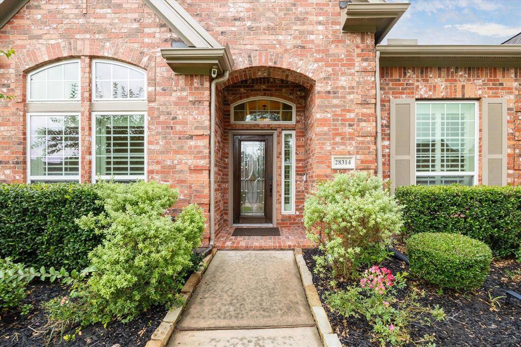 Lush, well-maintained landscaping, plush shrubs, and beautiful mature greenery that frame the classic brick exterior. A perfect blend of charm and pride of ownership welcomes you home.